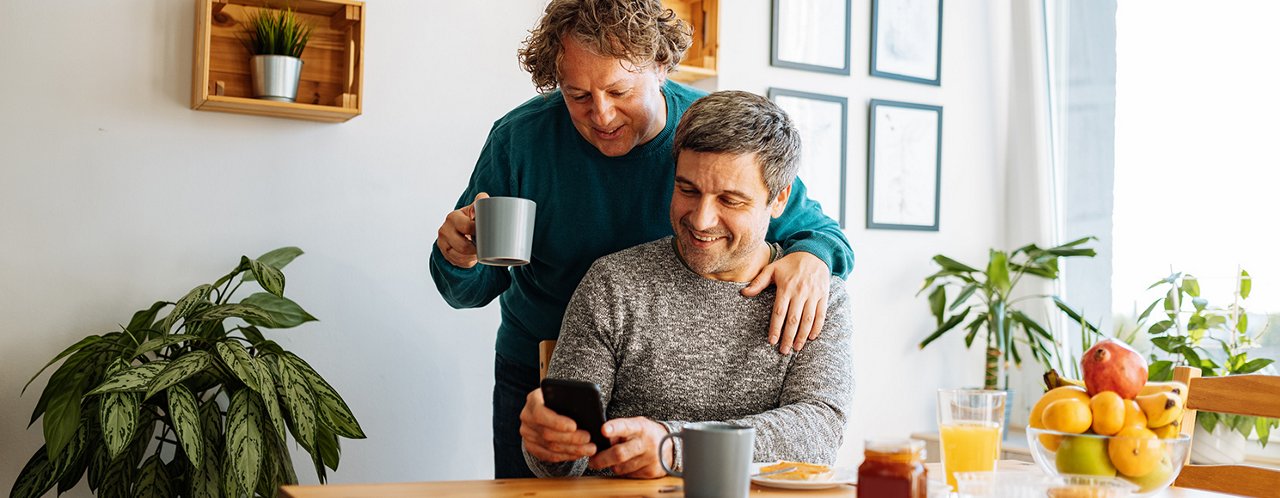 men looking at a phone