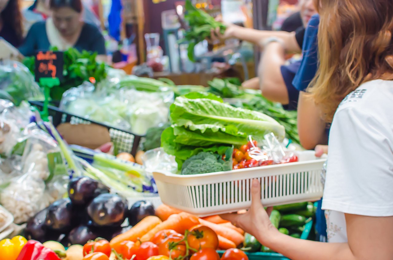Woman buying vegetables at the market