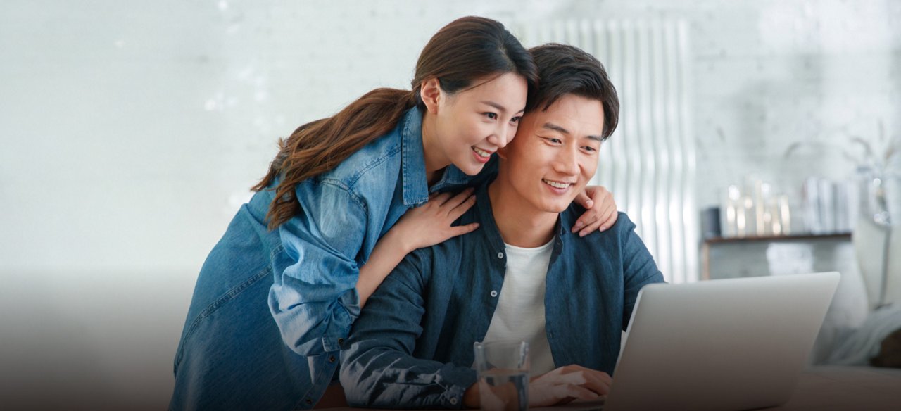 A young couple browsing VHIS and medical protection information.