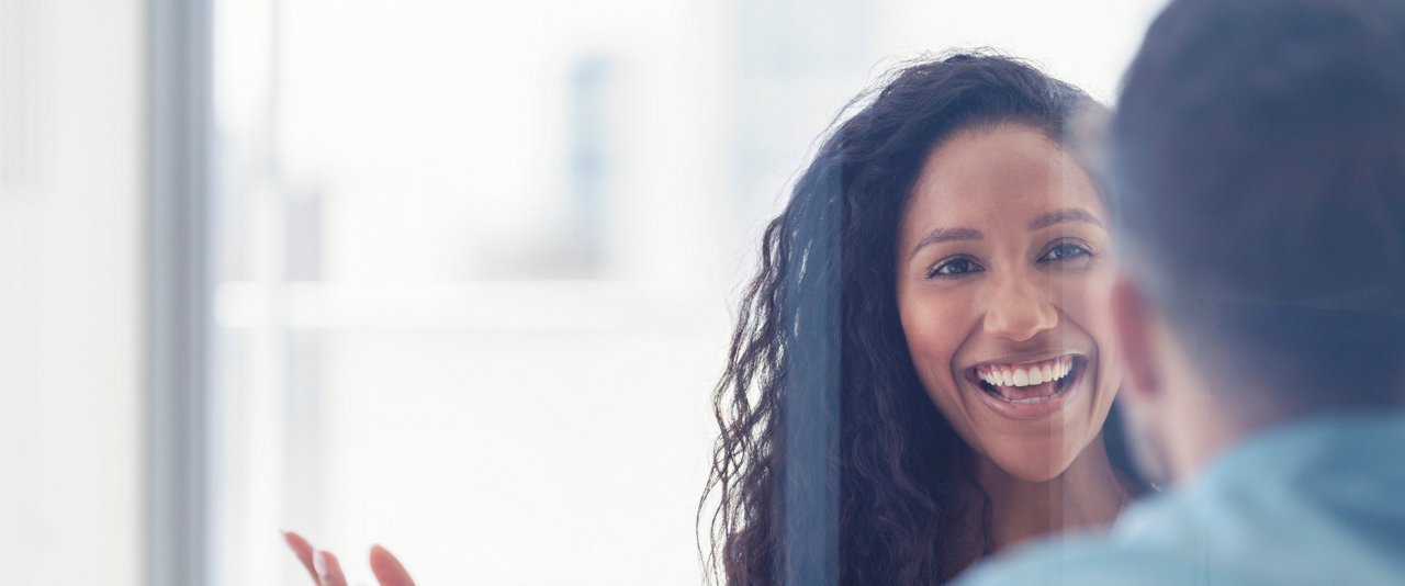 Woman smiling at colleague