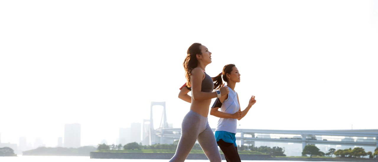 Women getting fit taking run afterwork in Tokyo