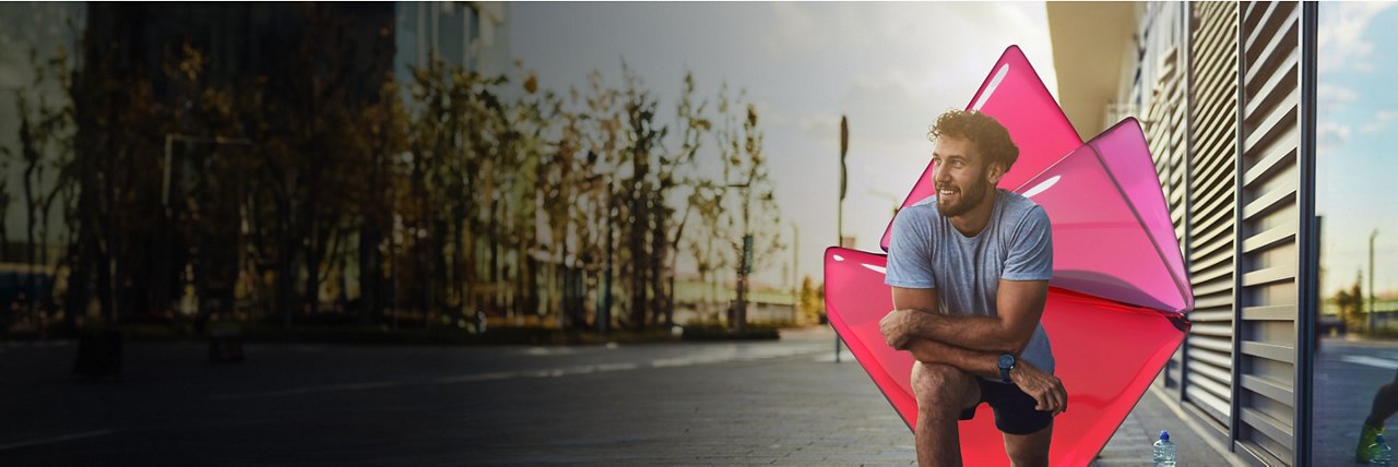 Young man jogging and taking a small break to observe the streets.