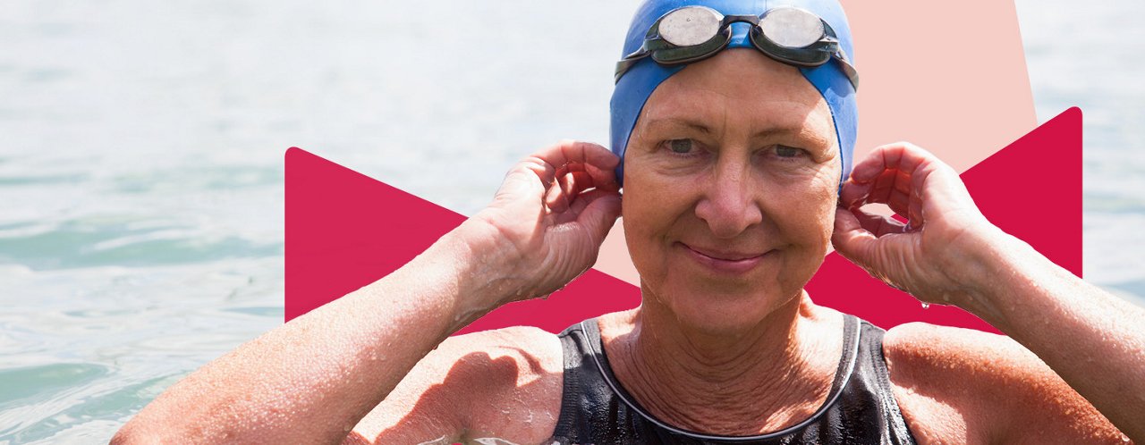 woman fixing swimming cap