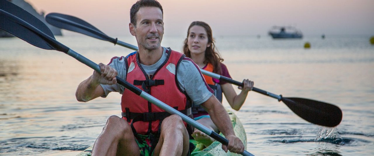 man and woman kayaking