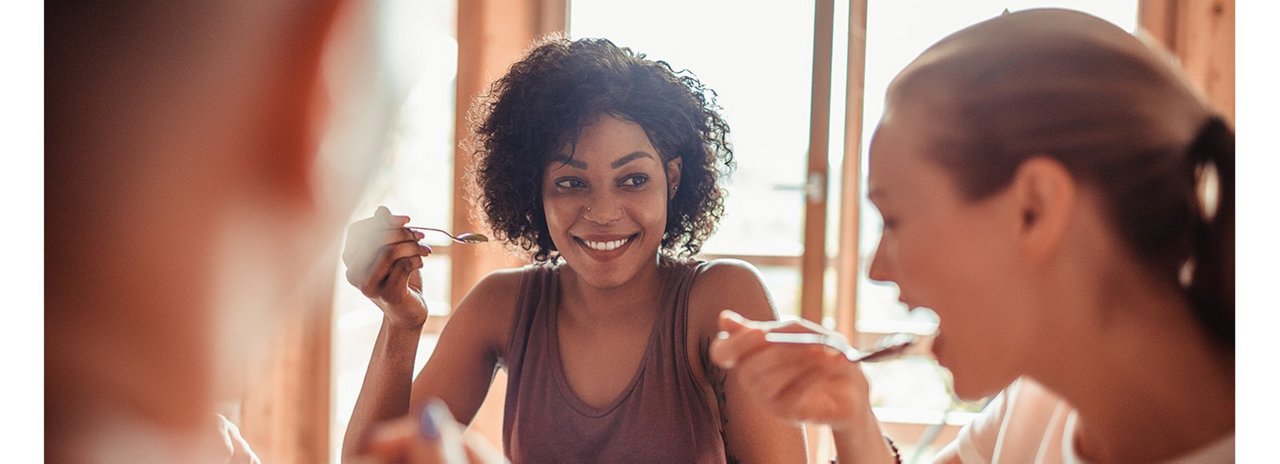 two women eating food