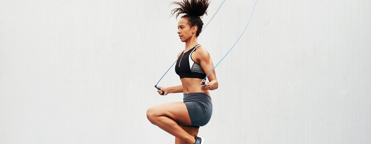 a woman doing exercise with a rope
