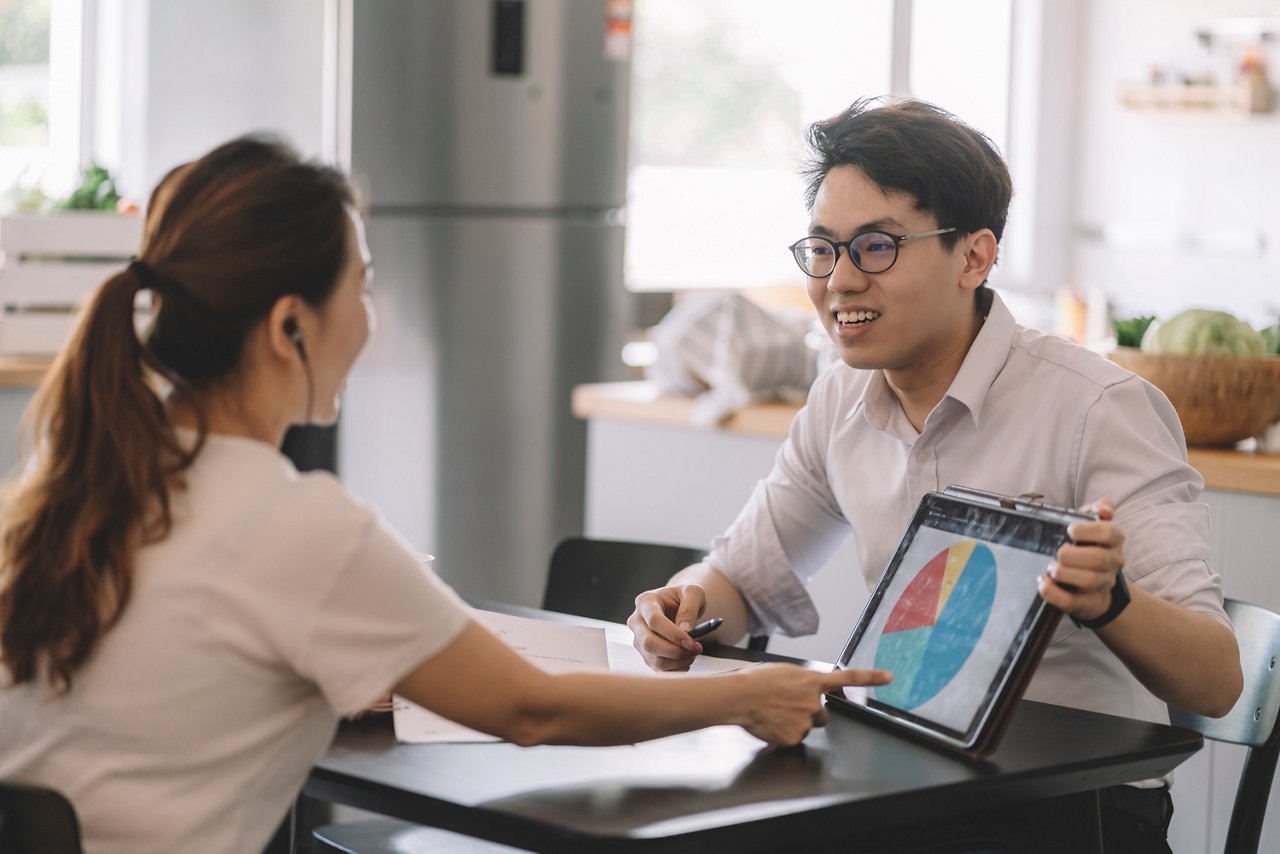 A woman consulting with a man on her financial investment options