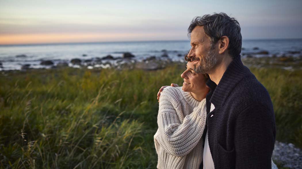 a man holding a woman