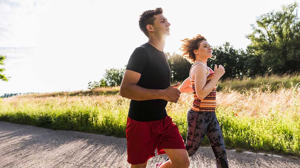 man and a woman jogging