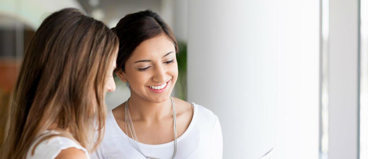 2 women smiling