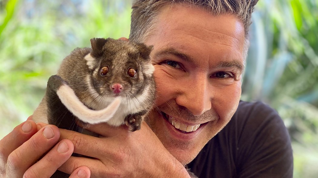 a man holding an animal