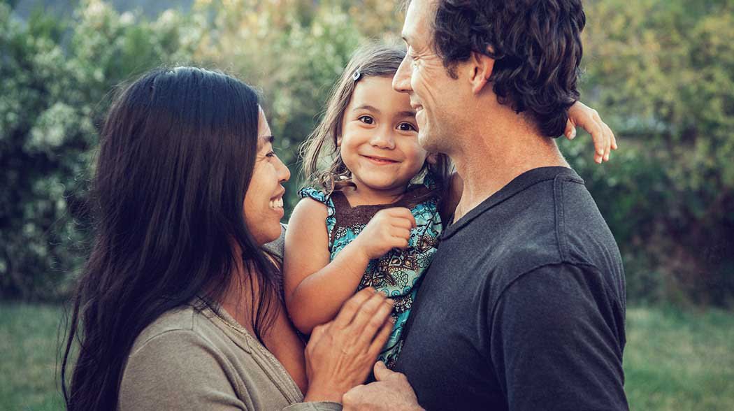 a family standing in a garden