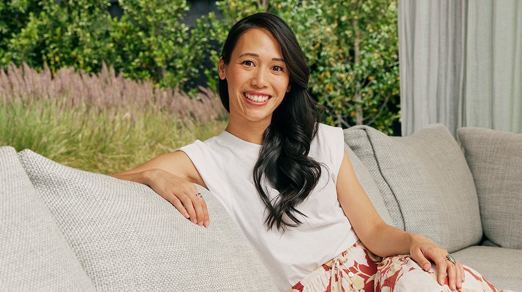 a woman sitting on a couch