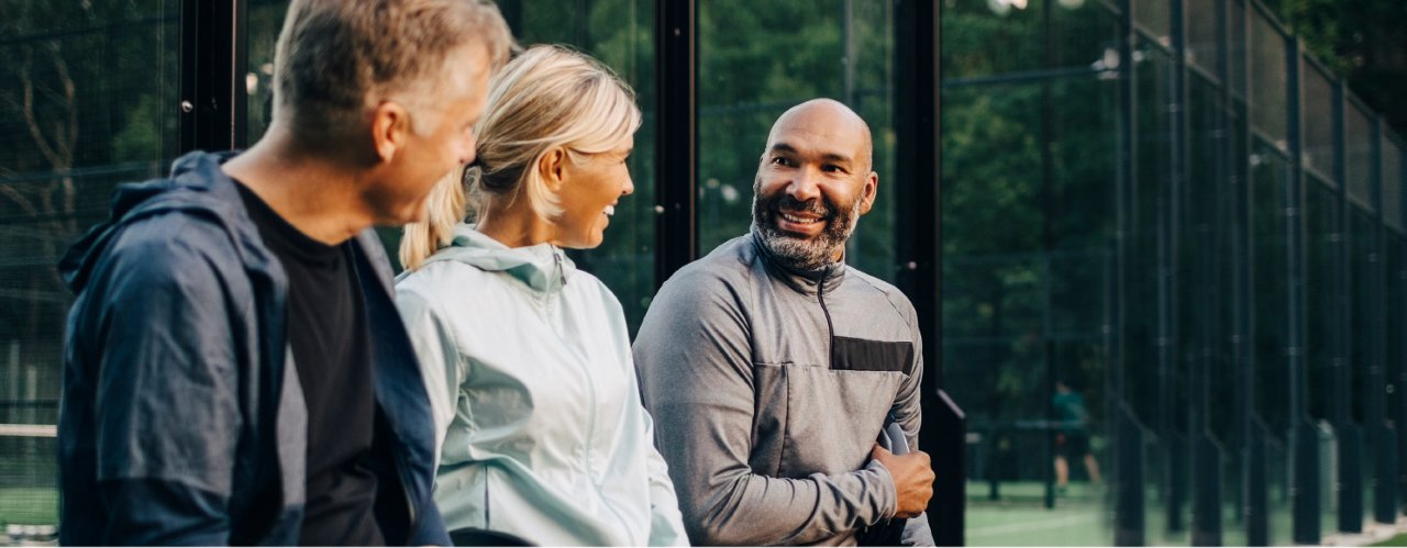 people talking in a garden