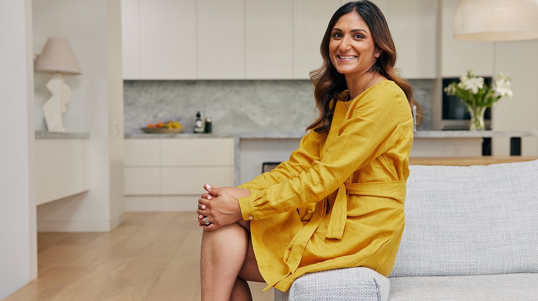 a woman sitting on a couch