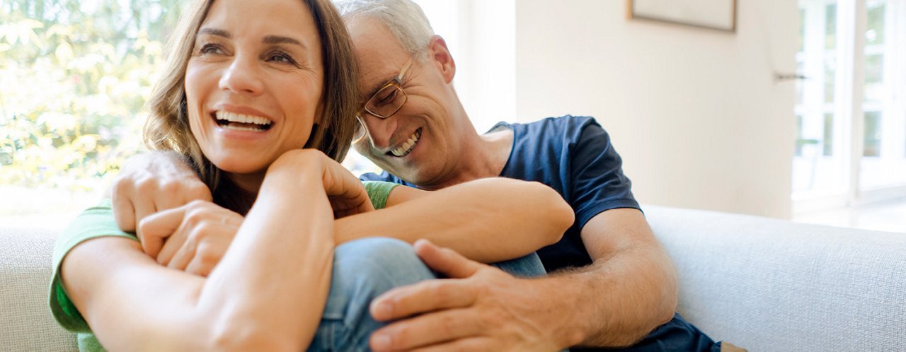 man hugging woman