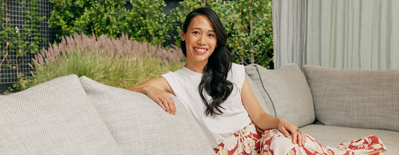 Women smiling sitting on the couch