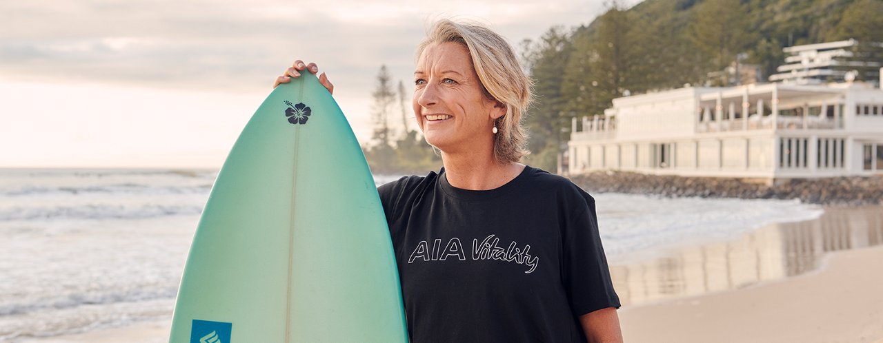 a woman holding a surf board