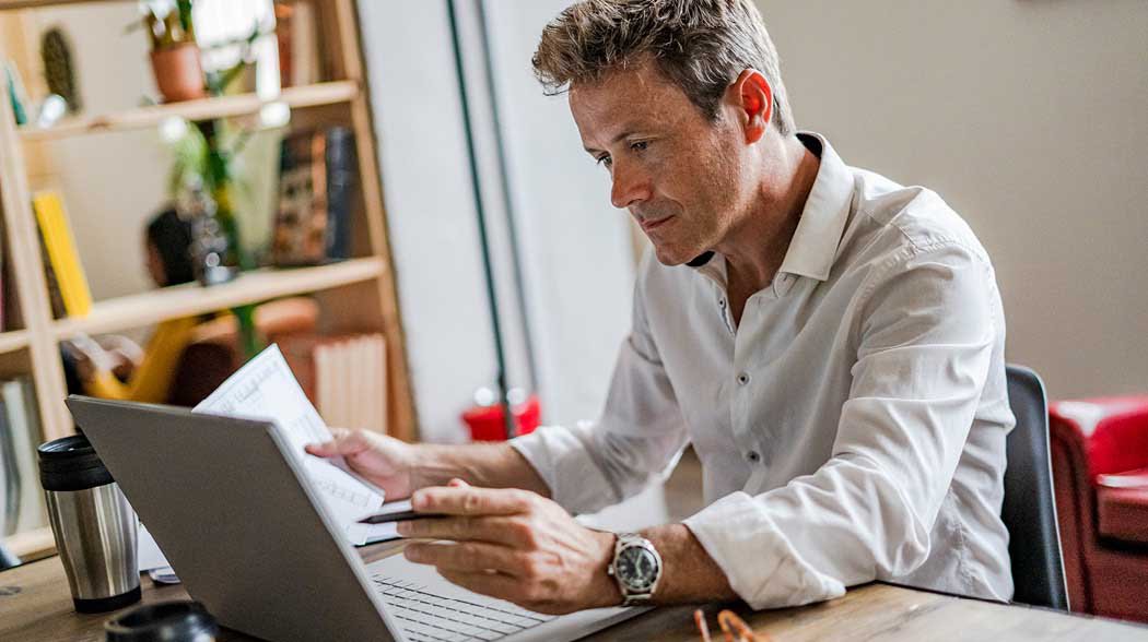 a man looking at papers