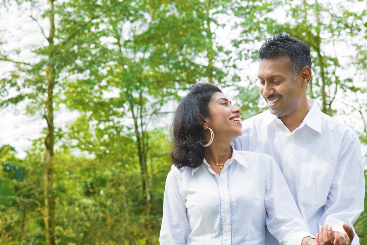 A couple walking together at an outdoor park
