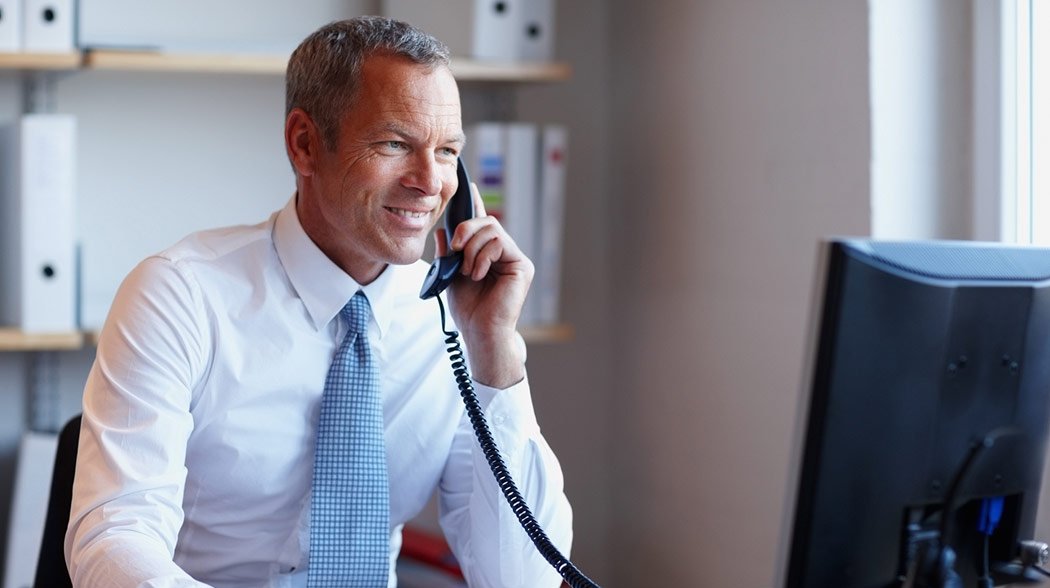 man talking on a telephone