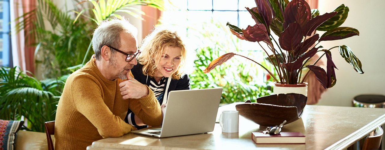 man woman checking laptop