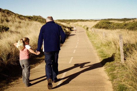 a man walking with a kid