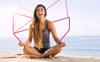 a woman sitting on a beach