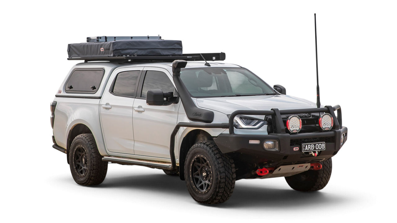 ARB equipped Isuzu D-MAX with a canopy, rooftop tent and ARB bull bar on a white studio background.