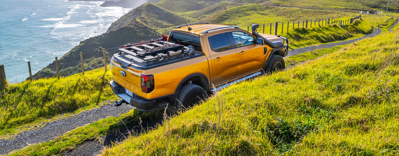 Ford Ranger on a cliff with the sea on the background.