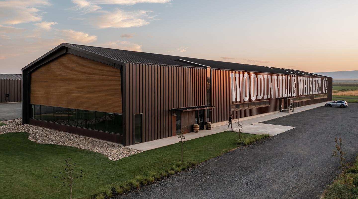 Contemporary brewery building with wood-accented metal facade demonstrating the design flexibility of a Butler pre-engineered metal building