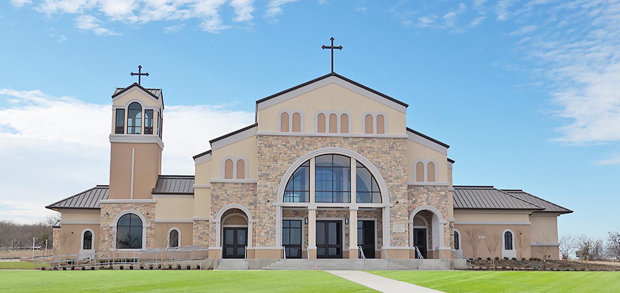 St. Thomas the Apostle Catholic Church featuring architectural stone facade, clear span worship space and steel building construction.