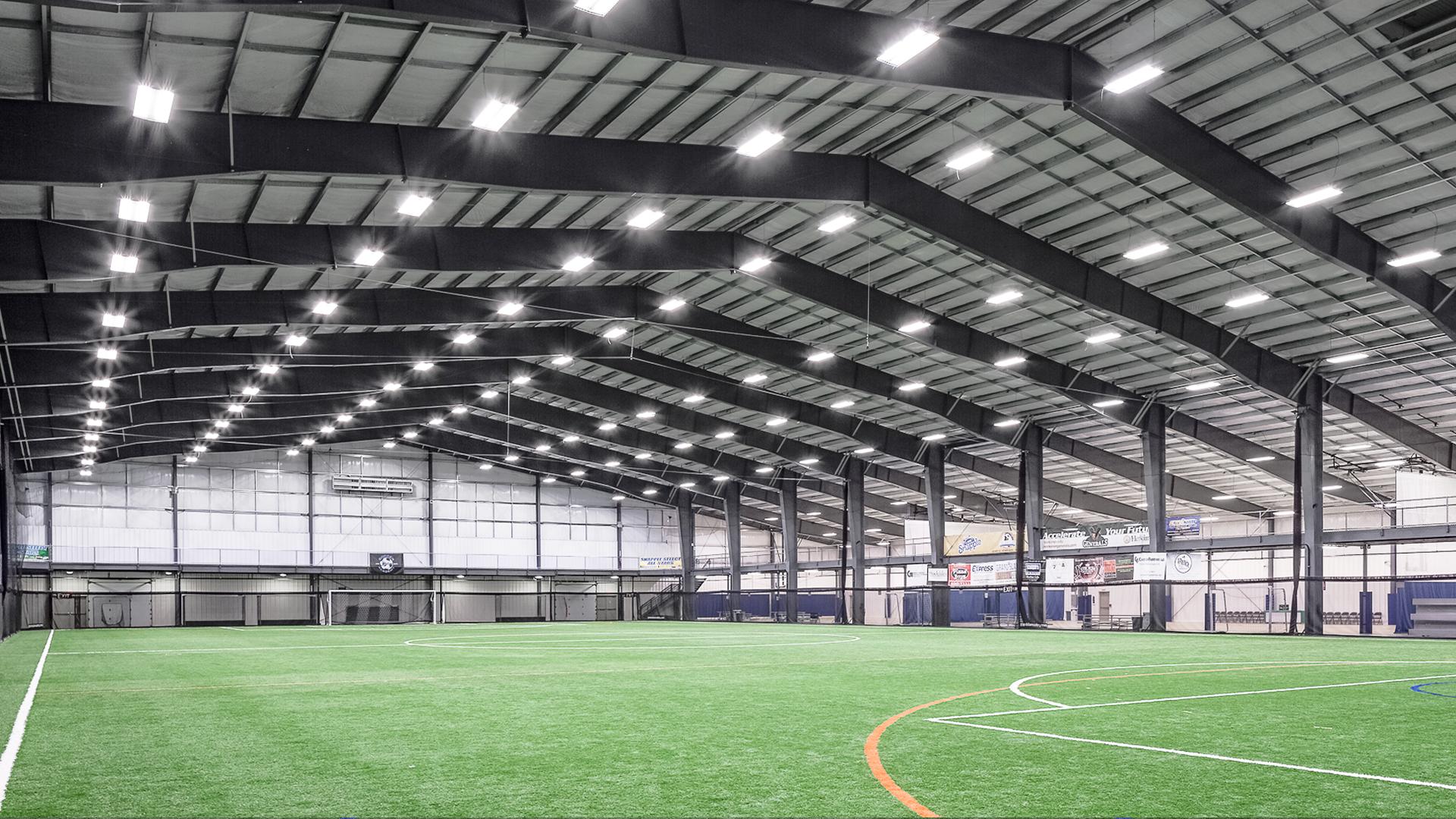 Large photo of athletic facility with soccer field on turf
