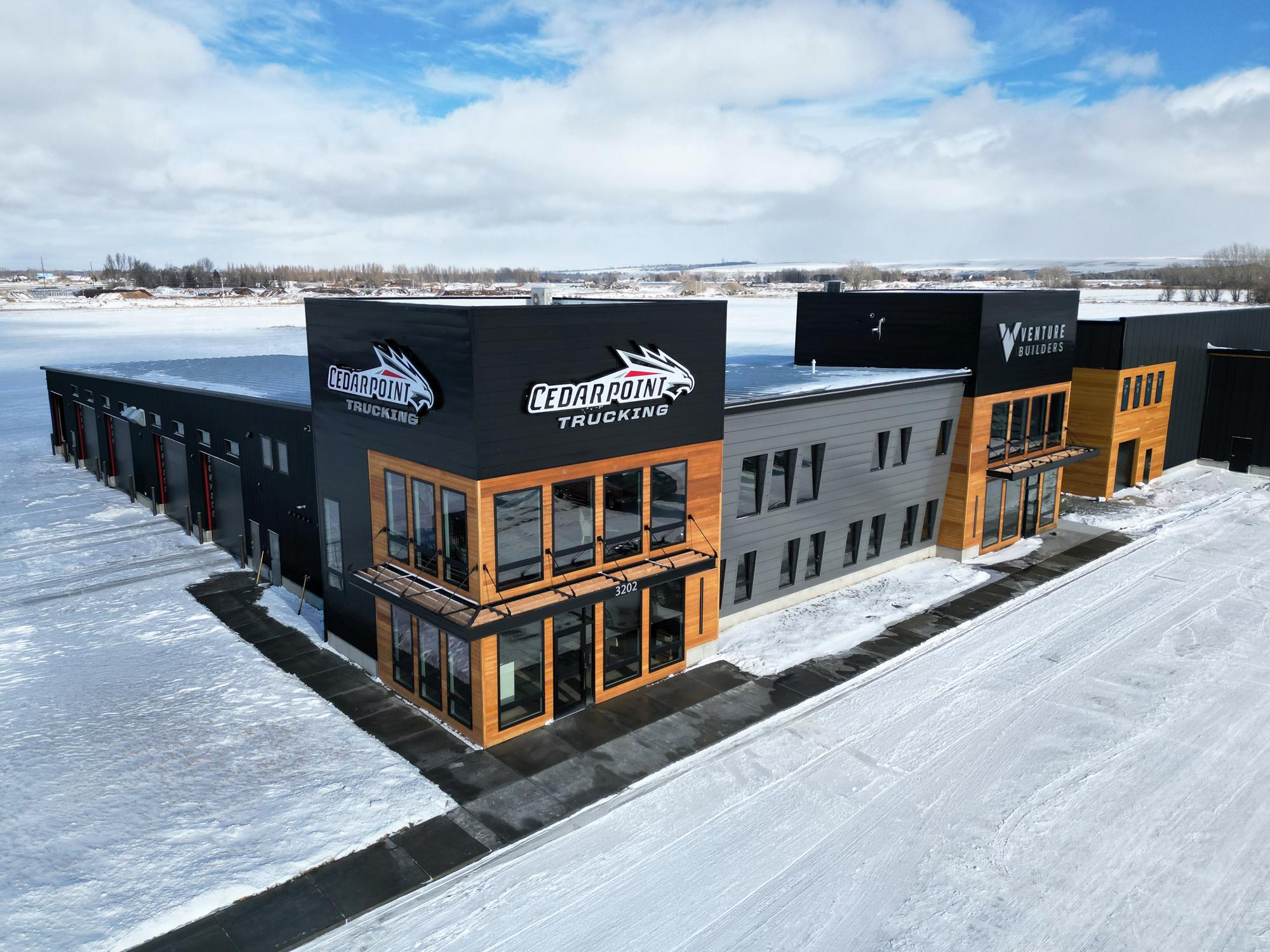 Aerial view of Cedarpoint Trucking Headquarters featuring modern office space and integrated fleet operations facility.