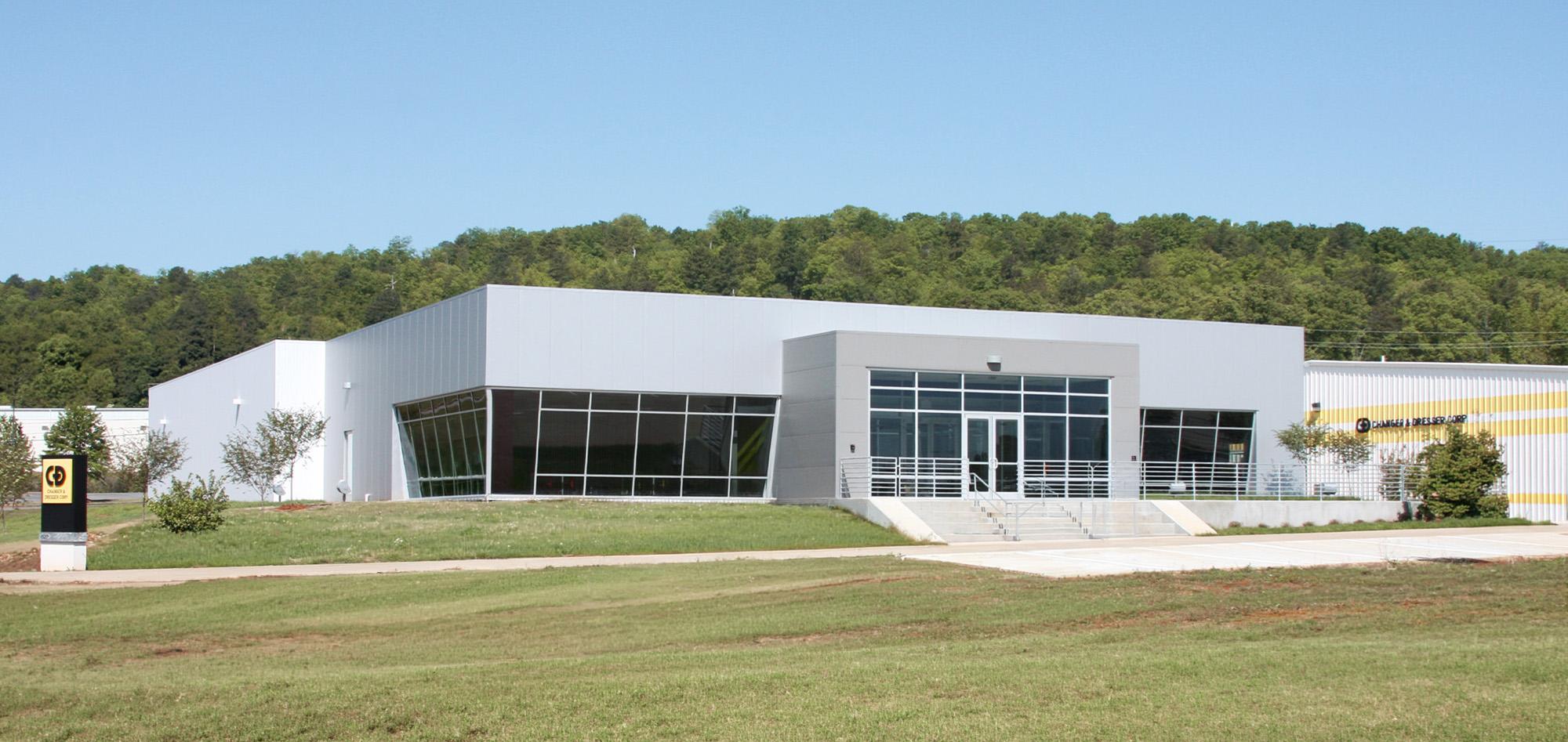 Commercial office building with architectural metal wall panels, curtain wall glazing and steel building construction.
