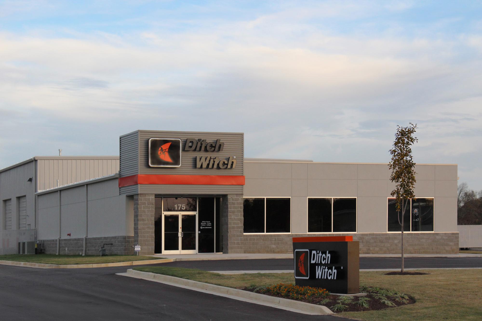 Exterior view of the Ditch Witch Mid South facility featuring service bays, office space and branded entrance.