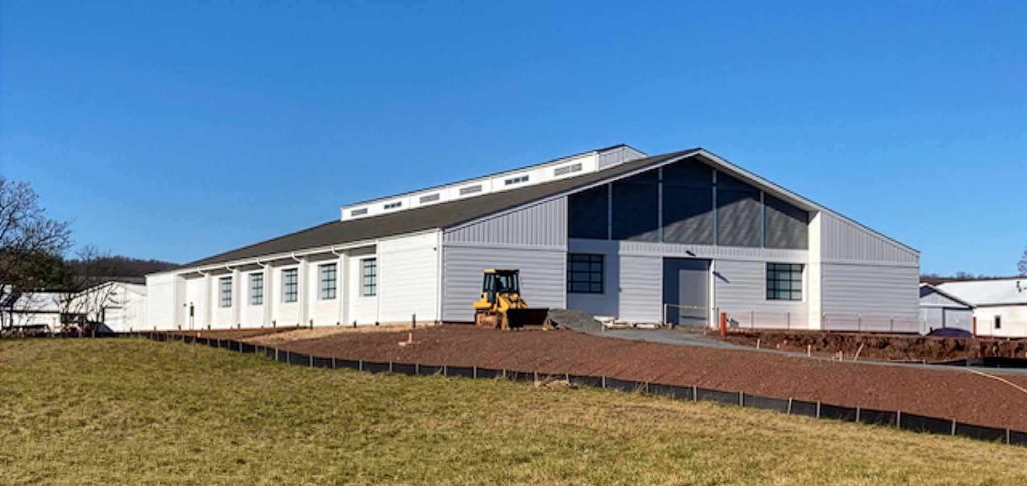 Exterior view of the Marion duPont Scott Equine Medical Center featuring a controlled indoor equine treatment and training environment designed to support year-round diagnostics, rehabilitation and integrated veterinary operations.