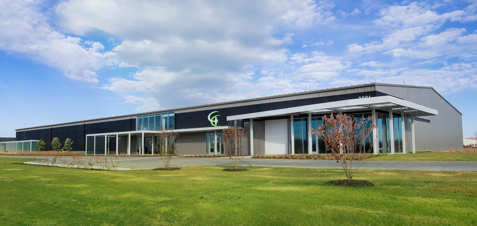 Exterior view of the Game Aerospace facility featuring integrated aircraft manufacturing, office and operational spaces designed to support efficient production workflows, specialized equipment needs and coordinated aviation operations.