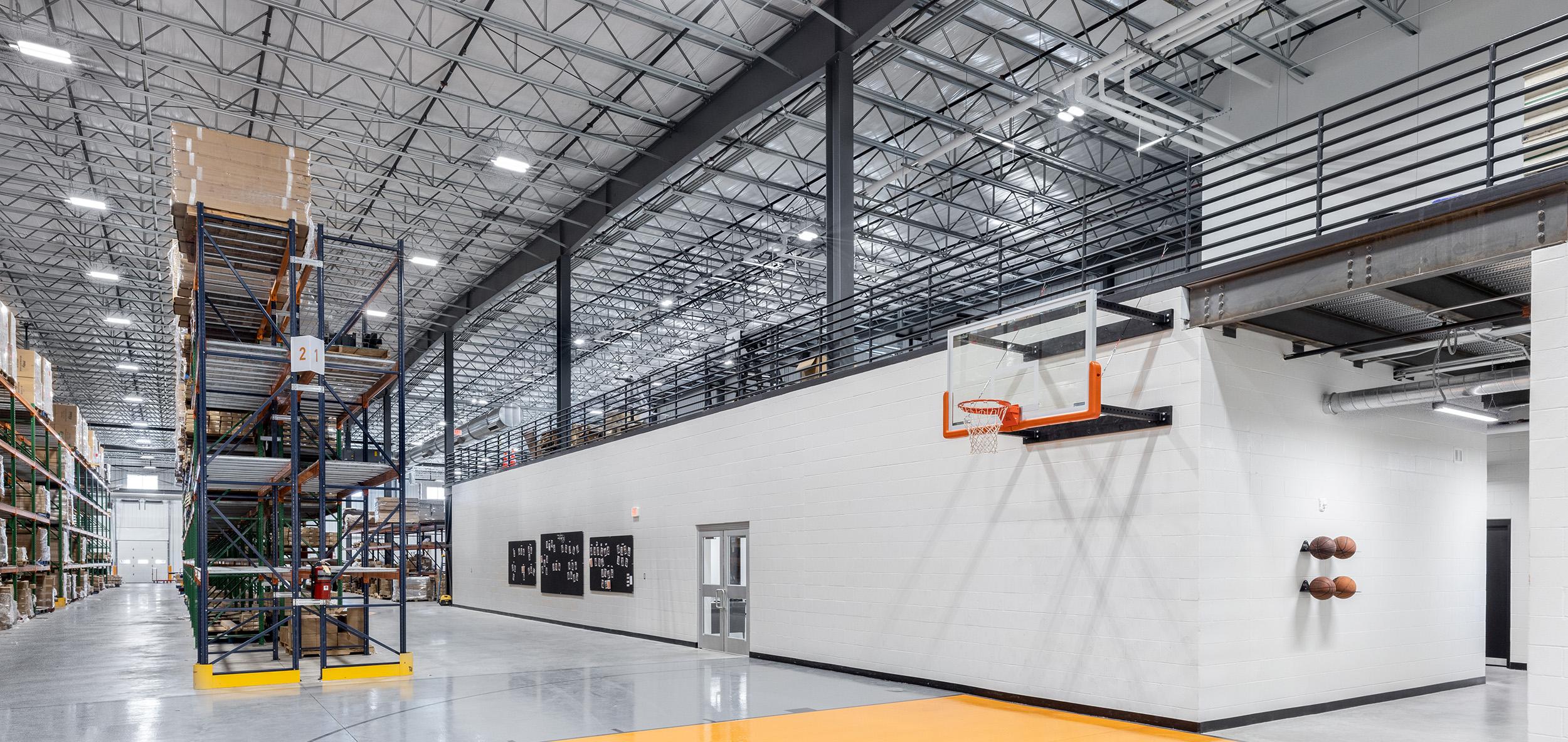 Expansive warehouse interior with tall pallet racking, exposed steel framing and polished concrete floors designed for large-scale distribution operations.