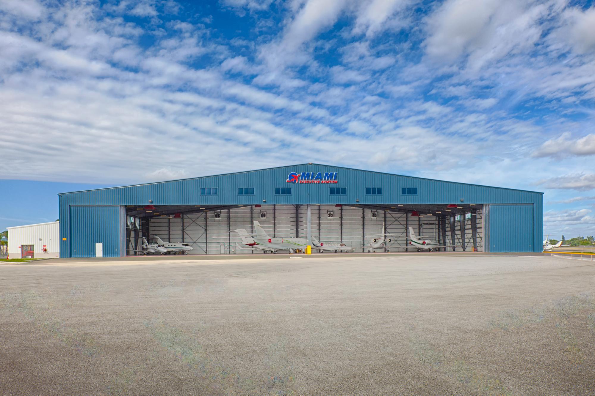 Miami Executive Aviation Hangar featuring clear span steel framing, aircraft hangar doors and pre-engineered metal building construction.