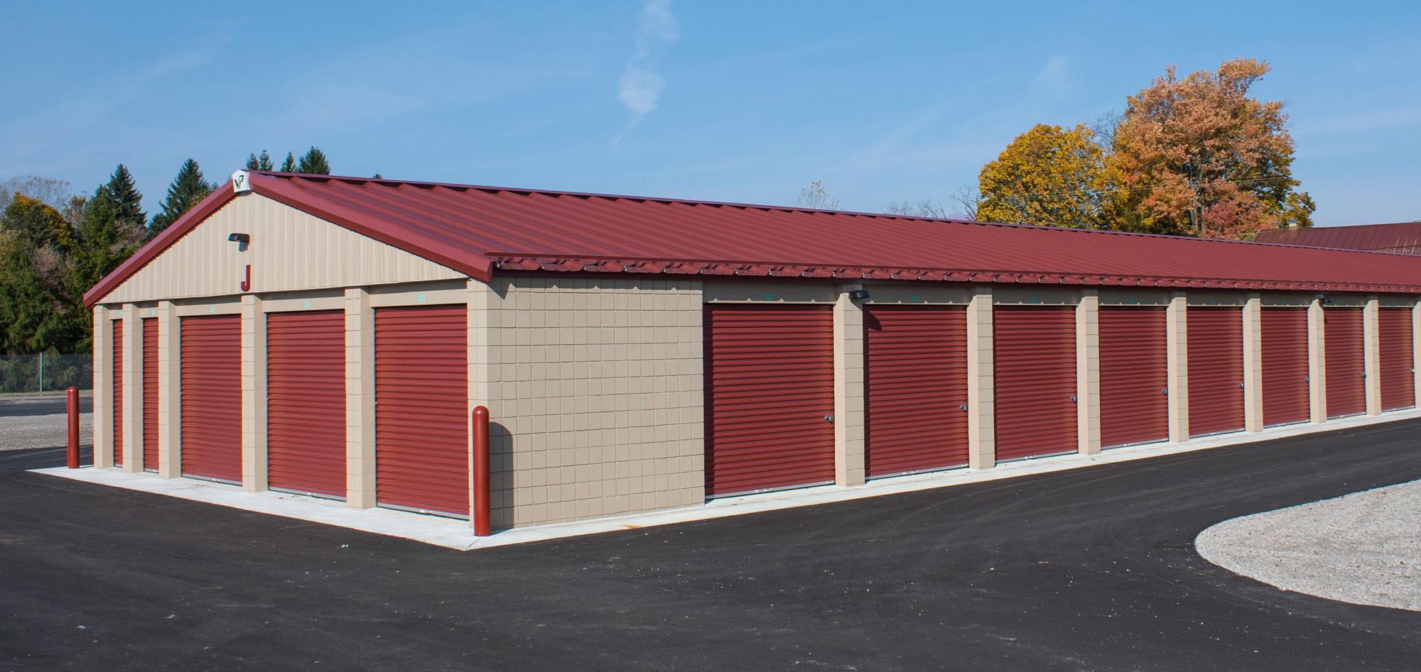Exterior view of the Pirates Cove self-storage facility featuring coordinated building design, durable steel construction and a unified operational environment developed to support efficient tenant access and long-term property performance.