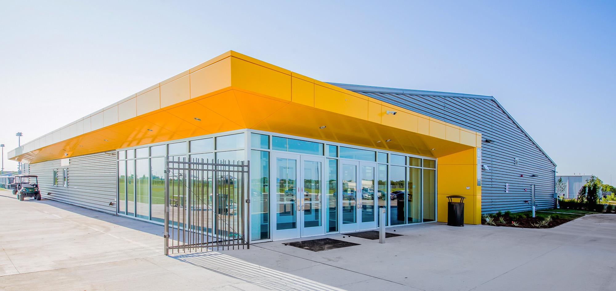 Stryker Sports Complex featuring architectural metal wall panels, curtain wall glazing and steel building recreation facility construction.