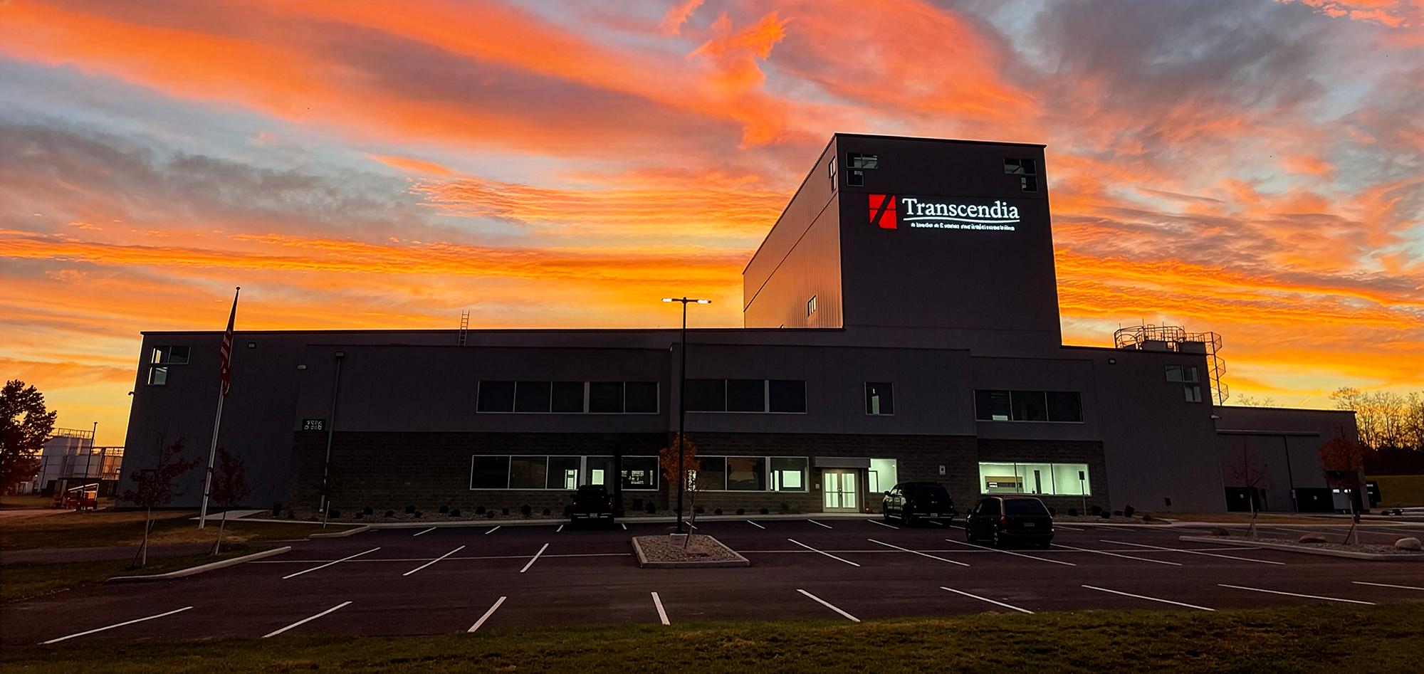 Exterior evening view of the Transcendia manufacturing facility featuring integrated production, office and support spaces designed to accommodate high-bay operations, specialized equipment and future manufacturing growth.