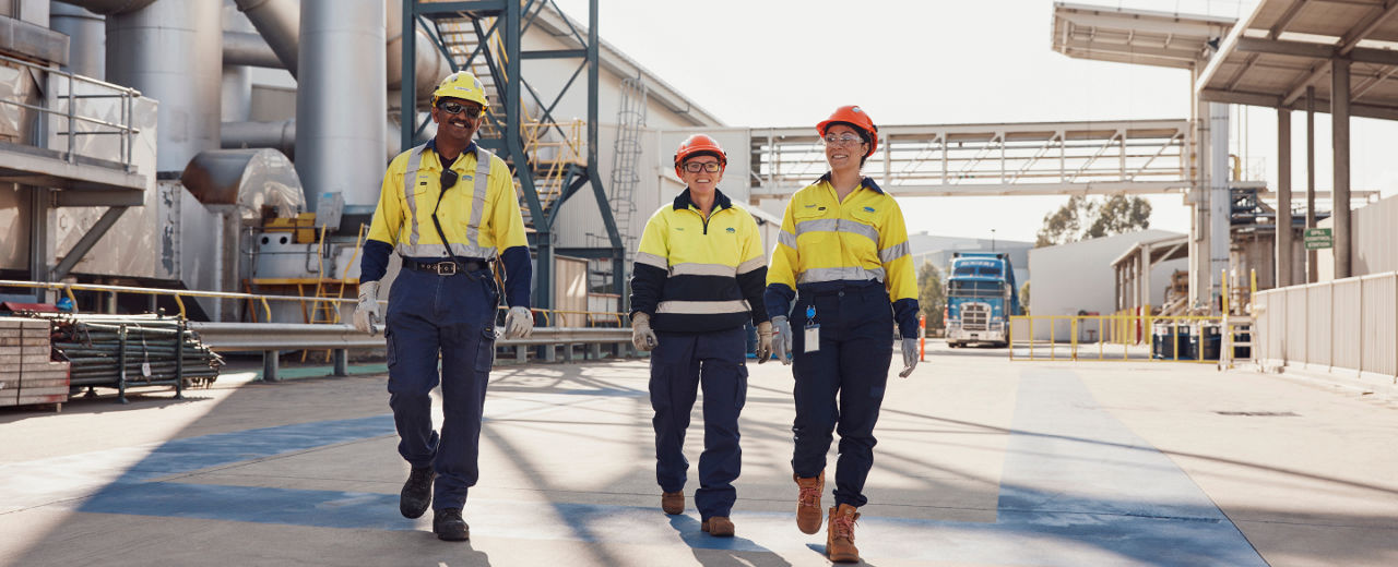 Group of BlueScope employees in a manufacturing facility 