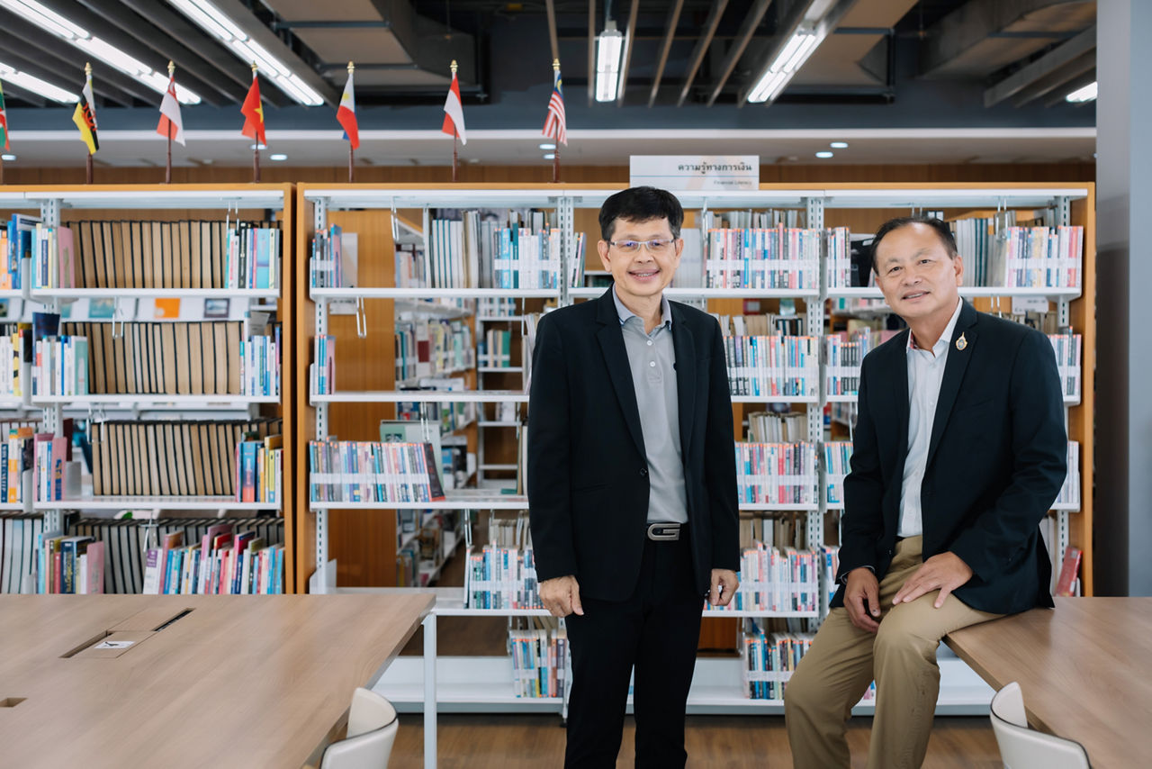 2 executives in library