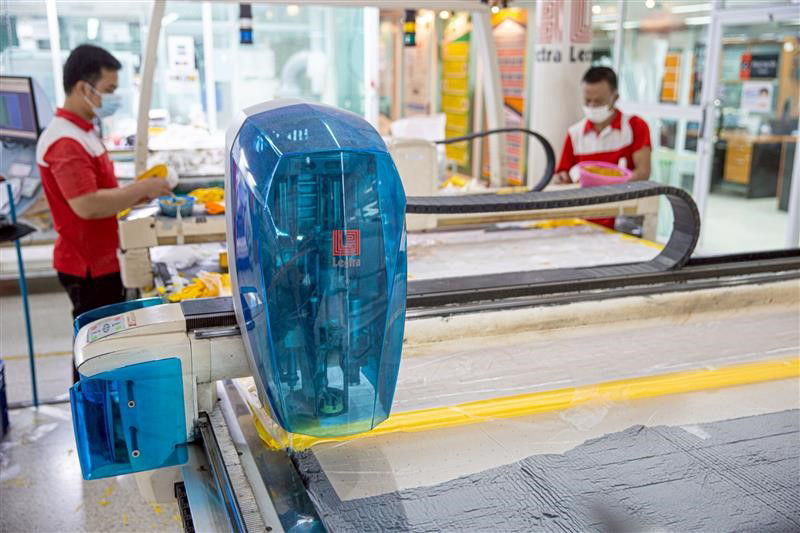 a textile factory wiht a machine in focus