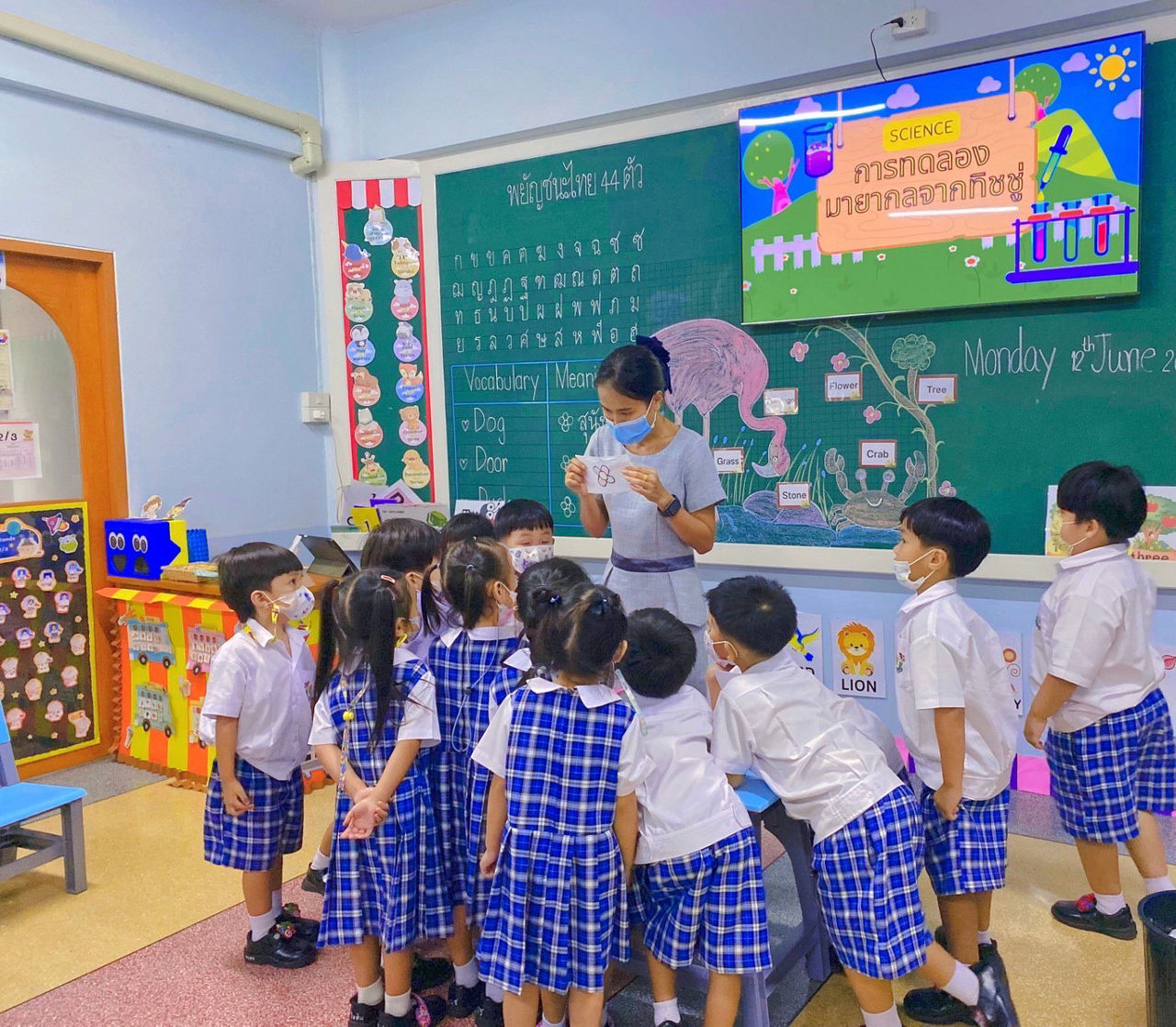 teacher with little students