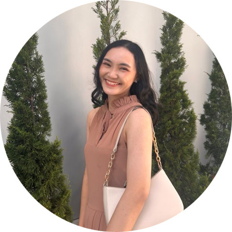 ID photo of Saruta Watcharayoo a young woman with black hair and black eyes and light tan complexion wearing a brown sleeveless outfit with a white purse