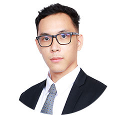 Portrait photo of Wasawat Champoontha, a young man with short black hair and glasses, wearing business attire