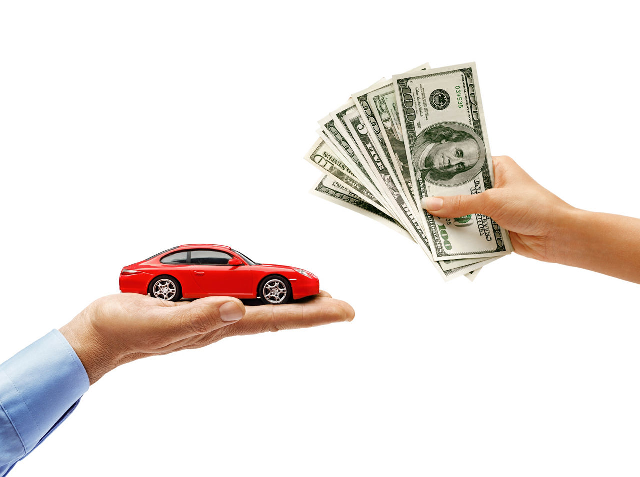 Woman's hand holding money and man's hand holding red car isolated on white background. Close up. High resolution product